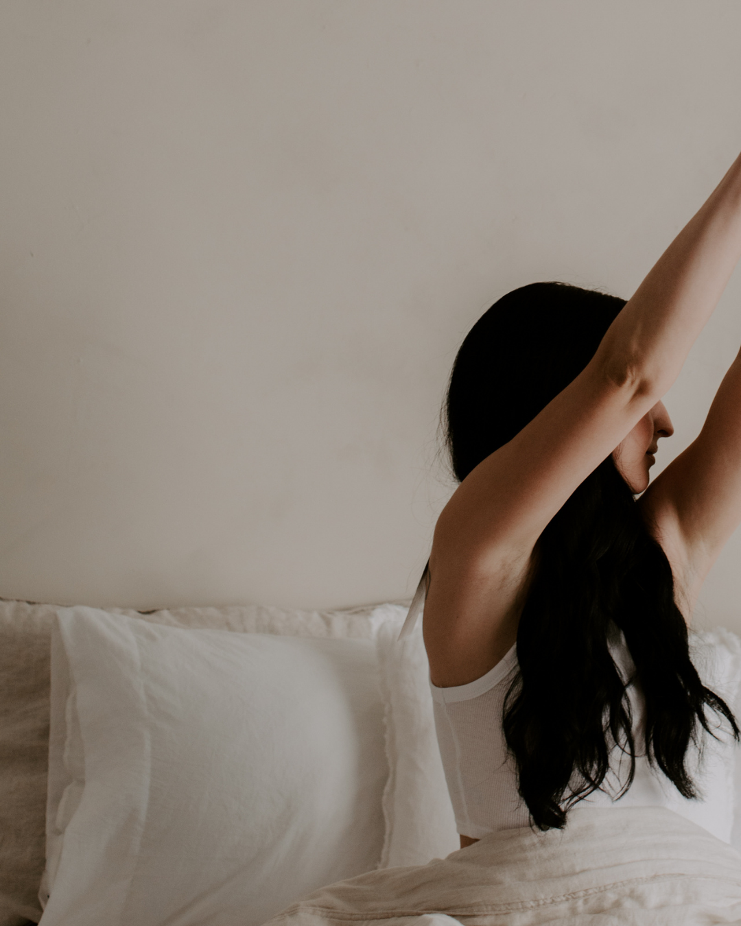 woman stretching needing b.calm magnesium spray