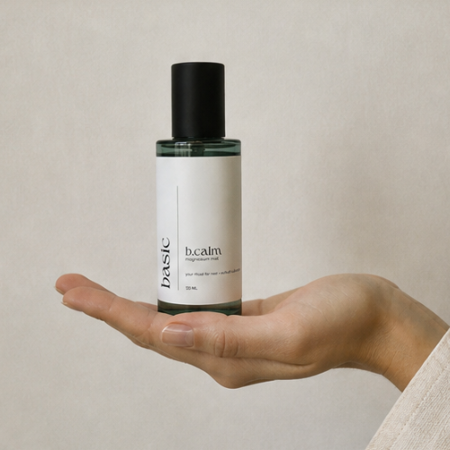b.calm magnesium mist bottle held in hand to show size