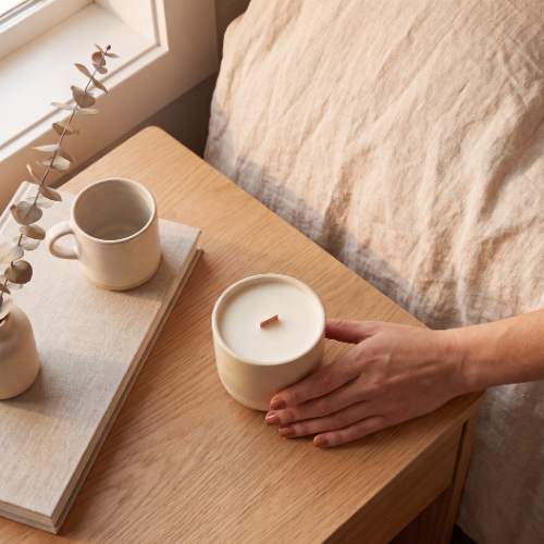 b.light Haven candle held in hand to show size