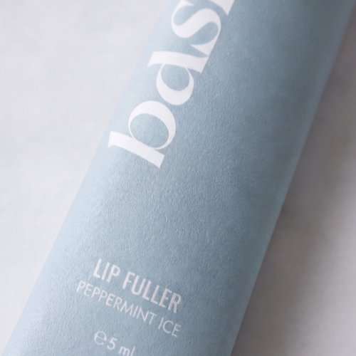 Close-up of b.full lip plumping gloss applicator wand