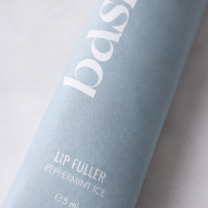 Close-up of b.full lip plumping gloss applicator wand